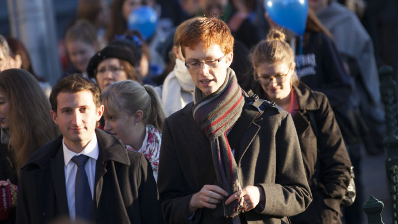 Crowd of people walking in a city
